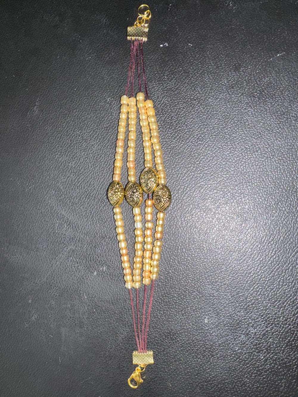 Gold Multi-Strand Beaded Bracelet with Filigree Medallions